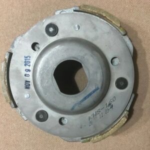 Metal mechanical part on a beige surface.