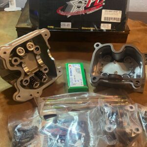 Engine repair parts and packaging on table.